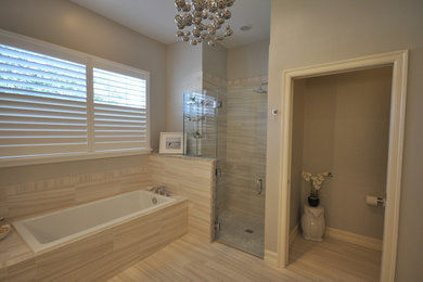 Example of a mid-sized transitional master gray tile and porcelain tile porcelain tile bathroom design in Miami with shaker cabinets, white cabinets, gray walls, an undermount sink, quartz countertops and a two-piece toilet