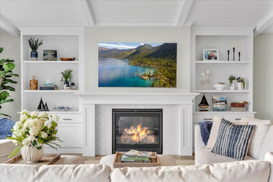 Inspiration for a large coastal open concept gray floor, wood ceiling and laminate floor living room remodel in San Francisco with green walls, a standard fireplace, a tile fireplace and a wall-mounted tv
