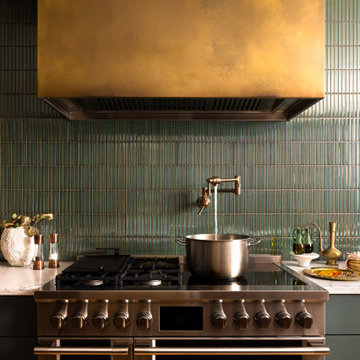 Professional Range with Aged Brass Hood and Green Tile Backsplash