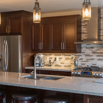 Falsetta - Brown Cabinets with Mosaic Tile Backsplash
