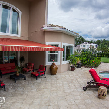 Retractable Screens and Awning give shade to gorgeous Windermere, FL home