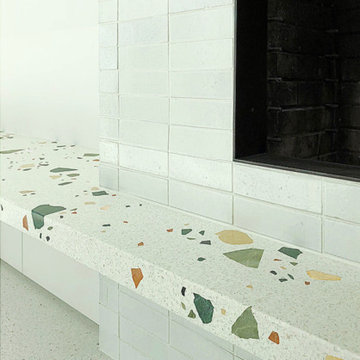 Mandy Moore White Brick Fireplace with Terrazzo Bench