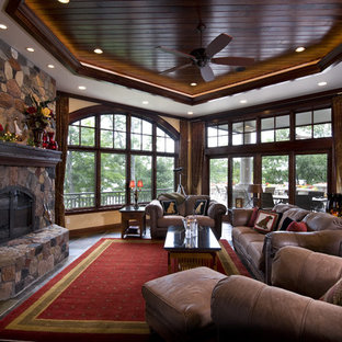 This is an example of a mediterranean formal living room in Minneapolis with beige walls, slate flooring, a standard fireplace and a stone fireplace surround.