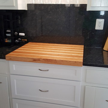 Sue's white kitchen and butcher block countertops.