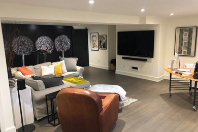 Basement - mid-sized contemporary vinyl floor, gray floor and wallpaper basement idea in Toronto with a home theater and white walls
