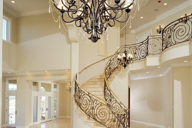 Large tuscan porcelain tile and beige floor foyer photo in Orange County with beige walls