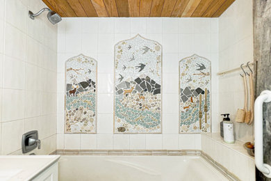 Eclectic master white tile and mosaic tile single-sink and wood ceiling drop-in bathtub photo in Boston with white cabinets, a one-piece toilet, white walls, an integrated sink and white countertops