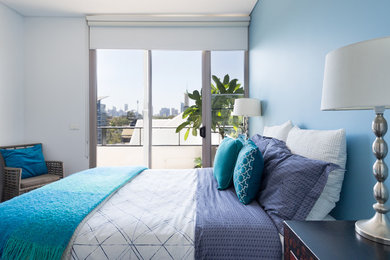 Design ideas for a contemporary bedroom in Sydney with blue walls.