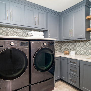 Gray Laundry Room with Patterned Tile Backsplash and Front-Load Washer Dryer | S