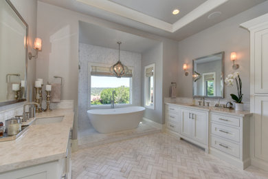 Freestanding bathtub - large transitional master white tile and marble tile marble floor, white floor and single-sink freestanding bathtub idea in Sacramento with shaker cabinets, white cabinets, quartz countertops, white countertops and a built-in vanity