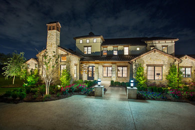 Example of a tuscan home design design in Dallas