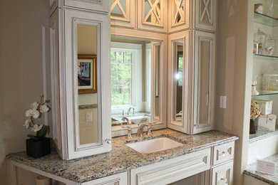 Bathroom - mid-sized traditional master beige tile bathroom idea in Other with recessed-panel cabinets, white cabinets, beige walls, an undermount sink and granite countertops