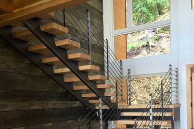 Example of a mid-sized trendy wooden u-shaped open staircase design in Seattle