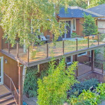Multilevel Deck with Spiral Staircase & Glass Handrail