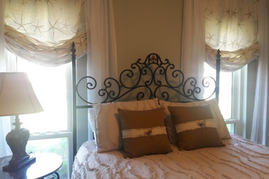 Design ideas for a medium sized nautical guest bedroom in Other with grey walls, laminate floors and brown floors.