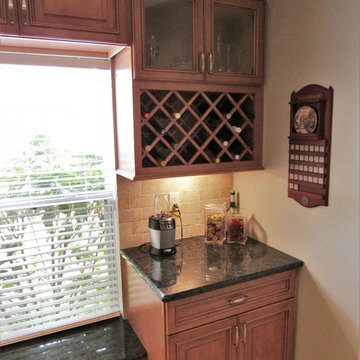 Galaxy Pecan cabinets with peacock green granite