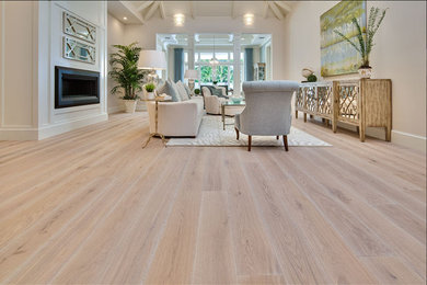 Example of a large transitional formal light wood floor living room design in New York with beige walls and a ribbon fireplace
