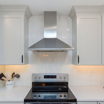 White Kitchen with Picket Backsplash