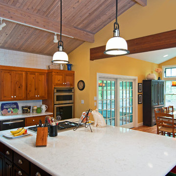 Lodge Look Makeover with Master Bedroom and Garage Addition in Wooded Setting