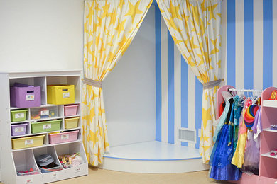 Photo of an eclectic gender-neutral kids' playroom for kids 4-10 years old in New York.