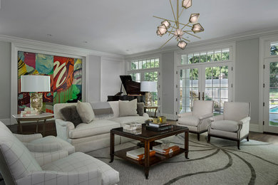 Living room - large traditional open concept dark wood floor and brown floor living room idea in Detroit with gray walls, a standard fireplace, a stone fireplace, a music area and no tv