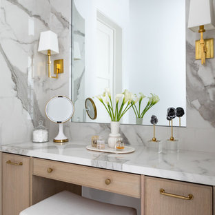 Example of a huge transitional master gray tile marble floor and gray floor bathroom design in Houston with light wood cabinets, white walls, a drop-in sink, a hinged shower door and a built-in vanity