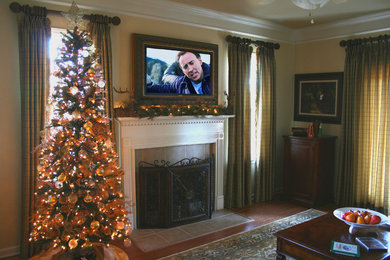 Example of a mid-sized arts and crafts enclosed medium tone wood floor family room design in Birmingham with beige walls, a standard fireplace and a tile fireplace