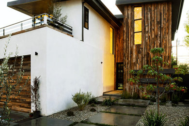 Large contemporary multicolored two-story wood flat roof idea in Los Angeles