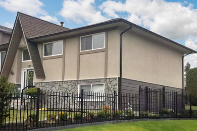Small one-story mixed siding house exterior idea in Vancouver
