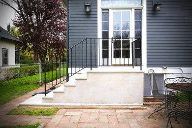 Inspiration for a mid-sized timeless blue two-story mixed siding house exterior remodel in Minneapolis