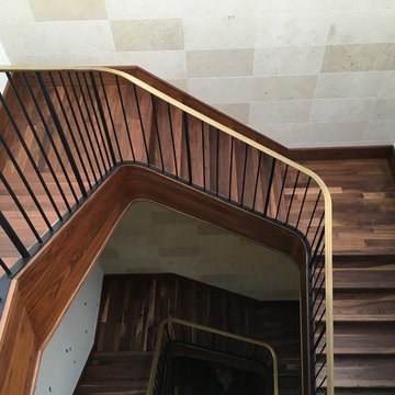 Walnut Stairs with Bronze Handrail and Iron Balusters