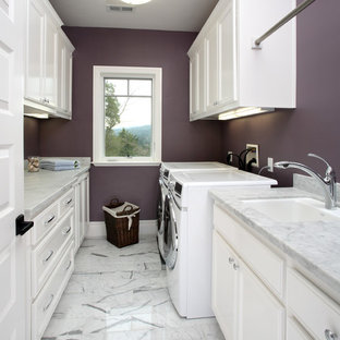 This is an example of a classic utility room in San Francisco with purple walls, white cabinets and white floors.
