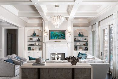 Inspiration for a large formal and open concept brown floor and tray ceiling living room remodel in Charlotte with gray walls, a standard fireplace and a wall-mounted tv