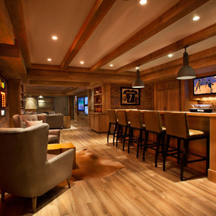 Design ideas for an expansive contemporary basement in New York with beige walls, medium hardwood flooring and no fireplace.