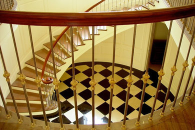 Example of a cottage chic wooden curved staircase design in Dallas with painted risers