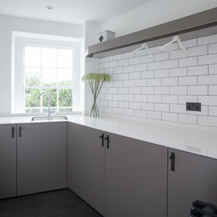 This is an example of a contemporary utility room in London.