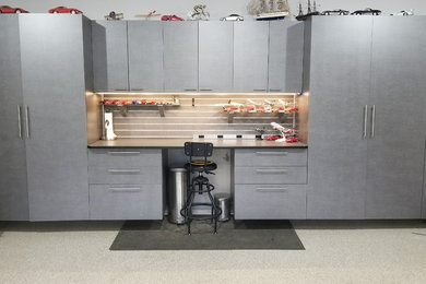 Inspiration for a large industrial attached two-car garage workshop remodel in Atlanta