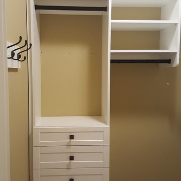 Small master closet in white