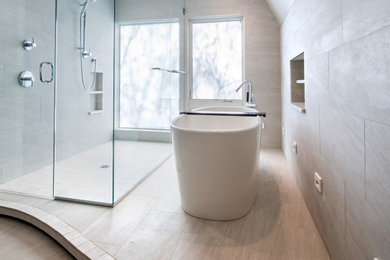 Bathroom - large contemporary beige tile and porcelain tile porcelain tile and beige floor bathroom idea in Boston with a hinged shower door and a niche