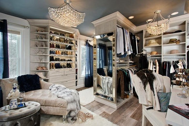 Inspiration for a mid-sized modern women's gray floor walk-in closet remodel in Other with gray cabinets