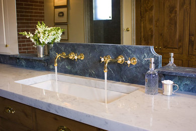Inspiration for a mid-sized timeless master bathroom remodel in Louisville with flat-panel cabinets, medium tone wood cabinets, yellow walls, an undermount sink and marble countertops
