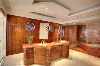 Large minimalist master beige tile and stone slab porcelain tile and beige floor bathroom photo in Miami with flat-panel cabinets, medium tone wood cabinets, an undermount sink and a hinged shower door