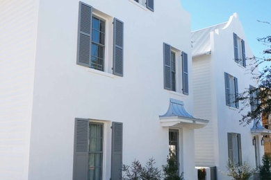 Inspiration for a huge transitional white three-story stucco exterior home remodel in Miami