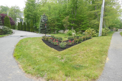 Inspiration for a mid-sized traditional partial sun front yard formal garden in Boston.