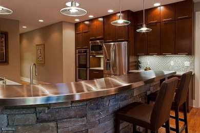 Example of a mid-sized trendy home design design in Boston