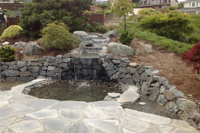 This is an example of a backyard water fountain landscape in Seattle.