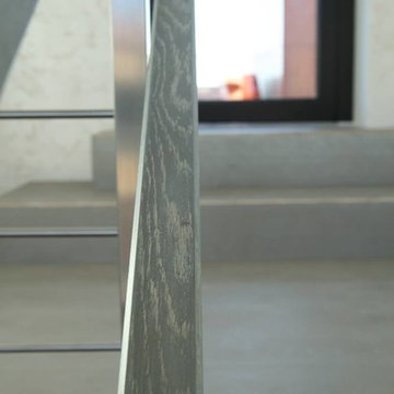 Modern metal stair covered by patina oak
