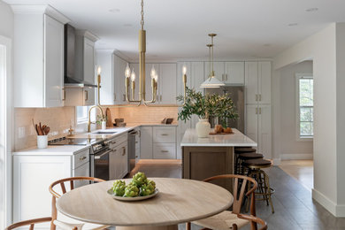 Eat-in kitchen - large transitional l-shaped gray floor eat-in kitchen idea in Burlington with an undermount sink, shaker cabinets, white cabinets, quartz countertops, white backsplash, ceramic backsplash, stainless steel appliances, an island and white countertops