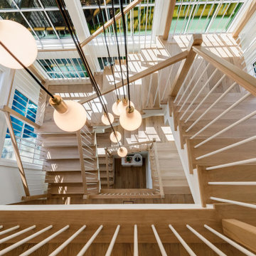 Project #152 | Three-Story White Oak Staircase with a Pendant Chandelier