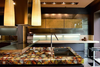Inspiration for a large transitional l-shaped enclosed kitchen remodel in Tampa with an undermount sink, flat-panel cabinets, brown cabinets, stainless steel appliances and an island